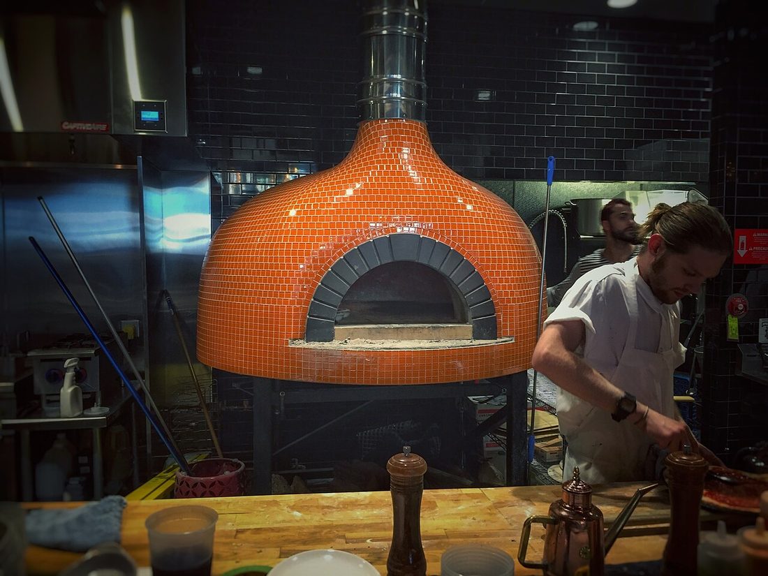 Wood-fired pizza oven in our kitchen